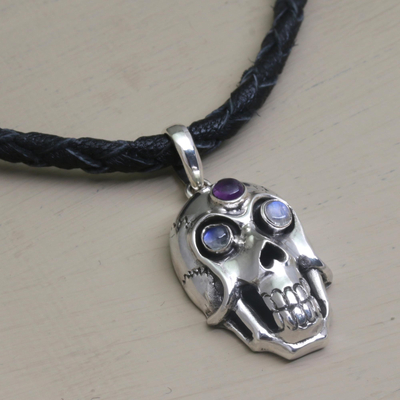 Rainbow moonstone and amethyst pendant necklace, 'Deadly Charm' - Rainbow Moonstone and Amethyst Skull Necklace from Indonesia