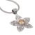 Citrine pendant necklace, 'Golden Center' - Silver Flower Pendant Necklace with 1.5 Carat Citrine