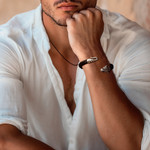 Men's sterling silver and leather cuff bracelet, 'Braided Tiger' - Men's Sterling Silver and Leather Tiger Bracelet from Bali