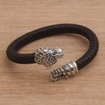 Men's sterling silver and leather cuff bracelet, 'Braided Tiger' - Men's Sterling Silver and Leather Tiger Bracelet from Bali