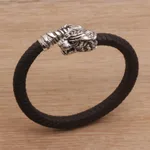 Men's sterling silver and leather cuff bracelet, 'Braided Tiger' - Men's Sterling Silver and Leather Tiger Bracelet from Bali
