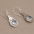 Blue topaz dangle earrings, 'Celestial Crowns' - Fair Trade Blue Topaz and Silver Earrings from Bali