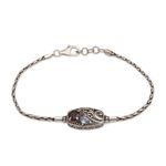 Garnet and blue topaz pendant bracelet, 'Crashing Waves' - Sterling Silver Blue Topaz and Garnet Pendant Bracelet