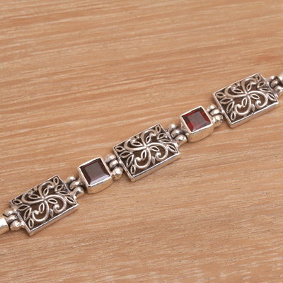 Garnet pendant bracelet, 'Kawung Blossom' - Javanese Batik Motif Pendant Bracelet with Garnets