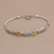 Citrine pendant bracelet, 'Kawung Blooms' - Citrine and Sterling Silver Pendant Bracelet with Chain
