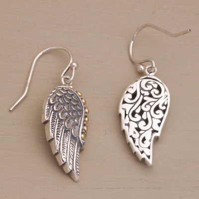 Gold accented sterling silver dangle earrings, 'Gleaming Swan Wings' - Gold Accent Sterling Silver Wing Dangle Earrings from Bali