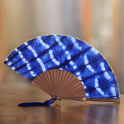 Tie-dyed cotton fan, 'Andira' - Tie Dyed Blue and White Cotton and Wood Hand Fan
