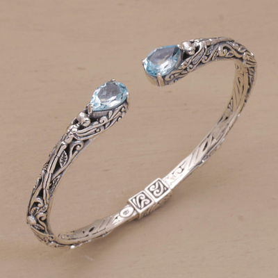 Blue topaz cuff bracelet, 'Looking for You' - Sterling Silver Hinged Blue Topaz Cuff Bracelet from Bali