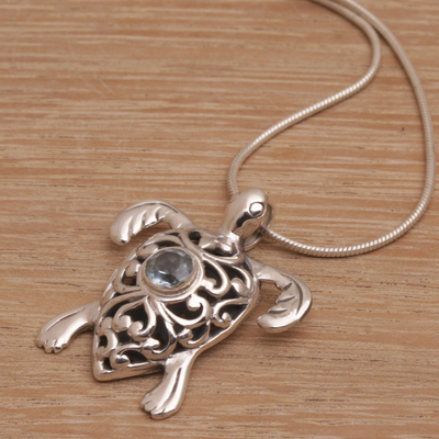 Blue topaz pendant necklace, 'Tulamben Turtle' - Handcrafted Sterling Silver Turtle Necklace with Blue Topaz