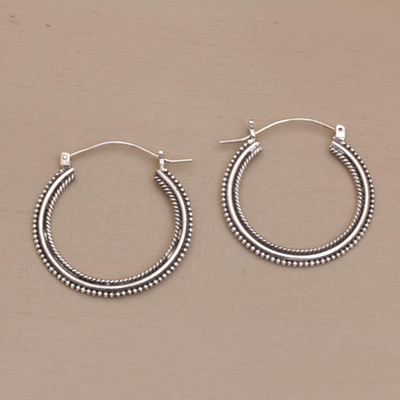 Sterling silver hoop earrings, 'On Rotation' (1.4 inch) - Sterling Silver Hoop Earrings with Textured Details (1.4 In)