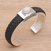 Rainbow moonstone and leather cuff bracelet, 'Strength and Femininity' - Silver Cuff Bracelet with Leather and Rainbow Moonstone