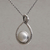 Cultured pearl pendant necklace, 'Mother Snake' - Cultured Pearl and Sterling Silver Snake Pendant Necklace thumbail