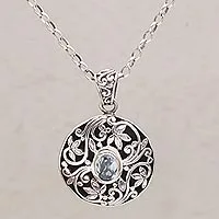 Blue topaz pendant necklace, 'Floral Eye in Blue'