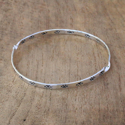 Sterling silver bangle bracelet, 'Circle of Paws' - Paw Print Motif Sterling Silver Bangle Bracelet from Bali