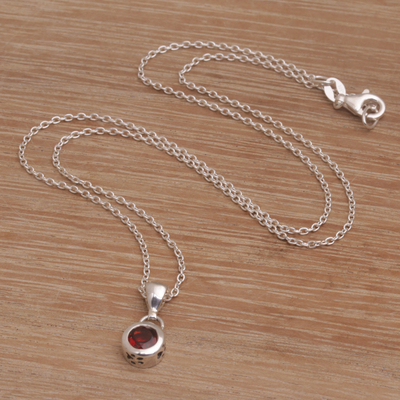Garnet pendant necklace, 'Glowing Paws' - Garnet and Sterling Silver Pendant Necklace from Bali