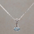 Blue topaz pendant necklace, 'Prized Paws' - Blue Topaz and Sterling Silver Paw Print Pendant Necklace