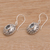 Blue topaz dangle earrings, 'Real Gift' - Oval Shaped Sterling Silver Earrings with Blue Topaz