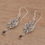 Garnet dangle earrings, 'Jepun Garden' - Garnet and Sterling Silver Frangipani Motif Earrings