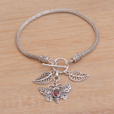Garnet charm bracelet, 'Butterfly Dawn' - Garnet and Silver Butterfly Charm Bracelet from Bali