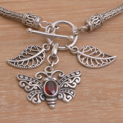 Garnet charm bracelet, 'Butterfly Dawn' - Garnet and Silver Butterfly Charm Bracelet from Bali