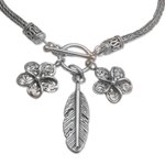 Sterling silver charm bracelet, 'Jepun Spirals' - Sterling Silver Frangipani Flower Charm Bracelet from Bali