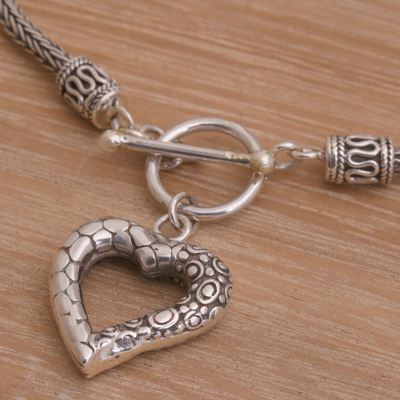 Sterling silver charm bracelet, 'Love Is Complex' - Sterling Silver Heart Charm Bracelet Crafted in Bali