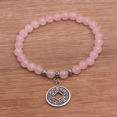 Rose quartz beaded stretch charm bracelet, 'Ancient Luck in Pink' - Rose Quartz Beaded Stretch Bracelet with Pis Bolong Coin