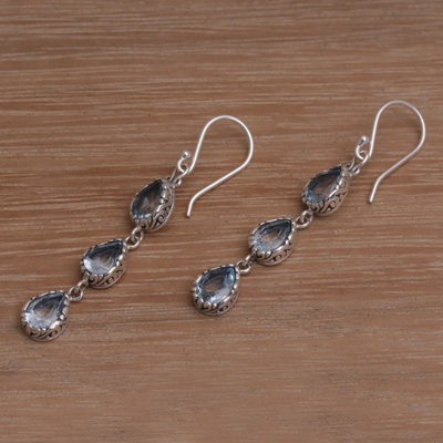 Blue topaz dangle earrings, 'Eternity Drop' - Blue Topaz and Sterling Silver Dangle Earrings from Bali