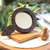 Coconut shell hand mirror, 'Coco Reflection' - Coconut Shell and MDF Hand Mirror of Indonesia