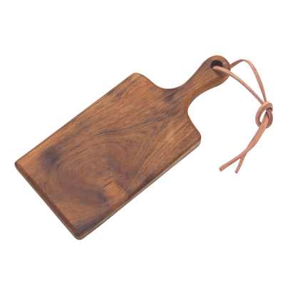 Teak wood cutting board, 'Dinner Party' - Teak Wood and Leather Accent Handcrafted Cutting Board