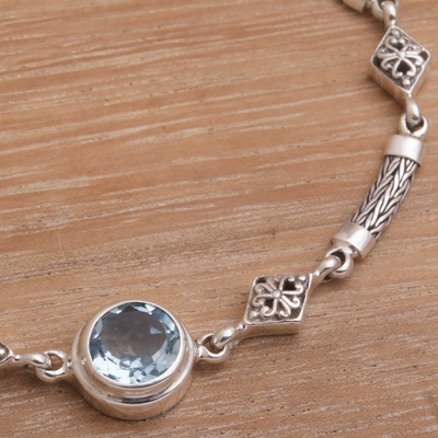 Blue topaz pendant bracelet, 'Sky Serenade' - Blue Topaz and Sterling Silver Pendant Bracelet from Bali