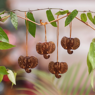 Coconut shell ornaments, 'Elephant with Golden Tusks' (set of 4) - Set of 4 Handmade Coconut Shell Elephant Ornaments