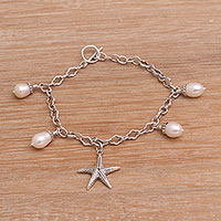 Cultured freshwater pearl charm bracelet, 'Sea Star' - Cultured Freshwater Pearl and Silver Starfish Charm Bracelet