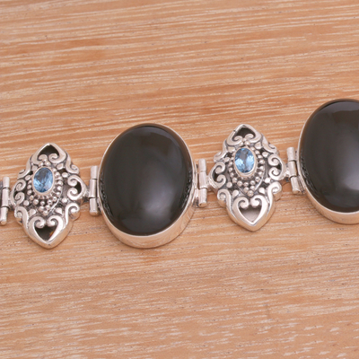 Onyx and blue topaz link bracelet, 'Enchanting Grace' - Onyx and Blue Topaz Sterling Silver Link Bracelet from Bali