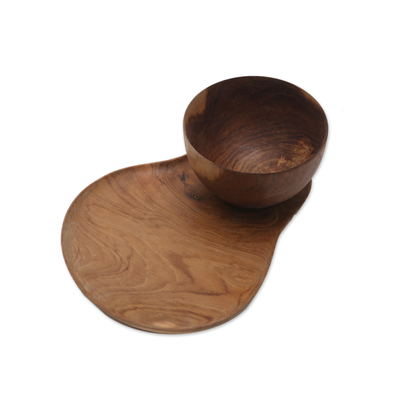 Teak wood plate and bowl set, 'Daytime Dining' - Teak Wood Plate and Bowl Dining Set Hand Carved in Java