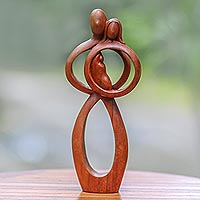 Wood sculpture, 'Infant Love' - Hand-Carved Suar Wood Parents and Newborn Family Sculpture
