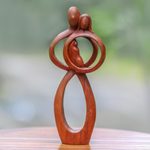 Wood sculpture, 'Infant Love' - Hand-Carved Suar Wood Parents and Newborn Family Sculpture