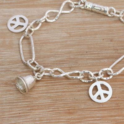 Sterling silver charm bracelet, 'Peaceful Infinity' - Sterling Silver Peace Symbol Charm Bracelet from Bali