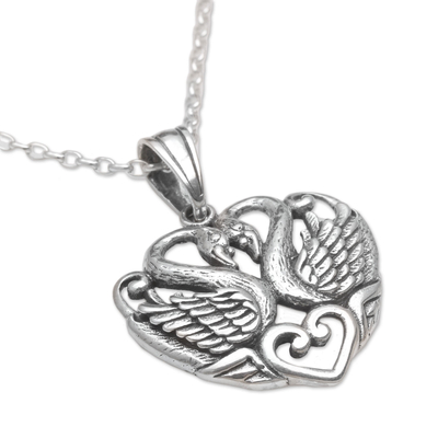 Elegant Sterling Silver swan pendant adorns this uniquely beaded necklace.
