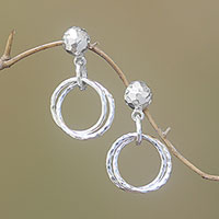 Sterling silver dangle earrings, 'Glistening Hoops' - Circular Sterling Silver Dangle Earrings from Bali