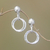 Sterling silver dangle earrings, 'Glistening Hoops' - Circular Sterling Silver Dangle Earrings from Bali (image 2) thumbail
