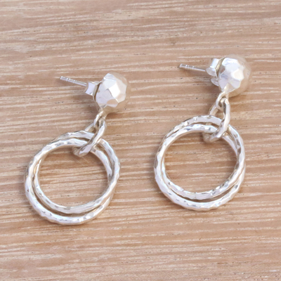 Sterling silver dangle earrings, 'Glistening Hoops' - Circular Sterling Silver Dangle Earrings from Bali