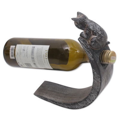 Wood bottle holder, 'Peeking Kitten' - Handcrafted Suar Wood Cat Bottle Holder in Black and White