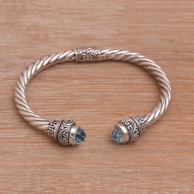Blue topaz cuff bracelet, 'Flourish in Blue' - Balinese Blue Topaz and Sterling Silver Cuff Bracelet