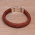 Leather wristband bracelet, 'Tranquil Weave in Orange' - Balinese Sterling Silver and Leather Wristband Bracelet thumbail