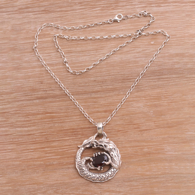 Garnet pendant necklace, 'Dragon's Gem' - Garnet and Sterling Silver Unisex Dragon Pendant Necklace