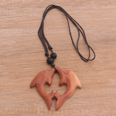 Wood pendant necklace, 'Brown Dolphin Duet' - Brown Wood Dolphin Pendant Necklace from Bali