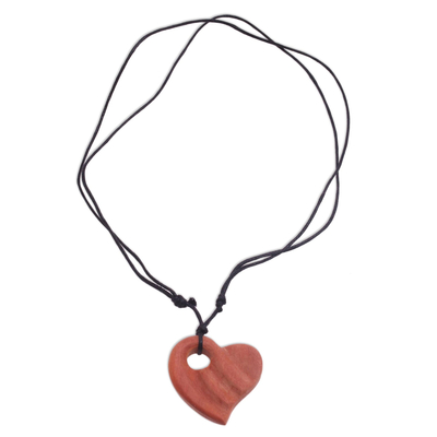 Wood pendant necklace, 'Wavy Heart' - Sawo Wood Heart-Shaped Pendant Necklace from Bali