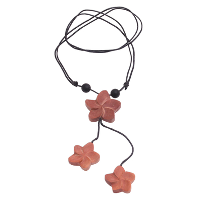 Wood pendant necklace, 'Three Jepuns' - Sawo Wood Frangipani Flower Pendant Necklace from Bali