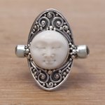 Blue topaz cocktail ring, 'Tranquil in Blue' - Carved Cow Bone Sterling Silver Blue Topaz Cocktail Ring